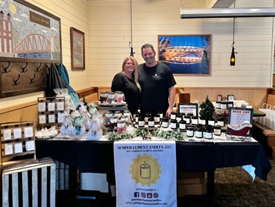 Semper Lumen Candles, LLC is all set up in the dining room! They have hand painted snowmen candles and ornaments too!! So cute!