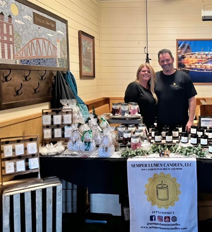 Semper Lumen Candles, LLC is all set up in the dining room! They have hand painted snowmen candles and ornaments too!! So cute!